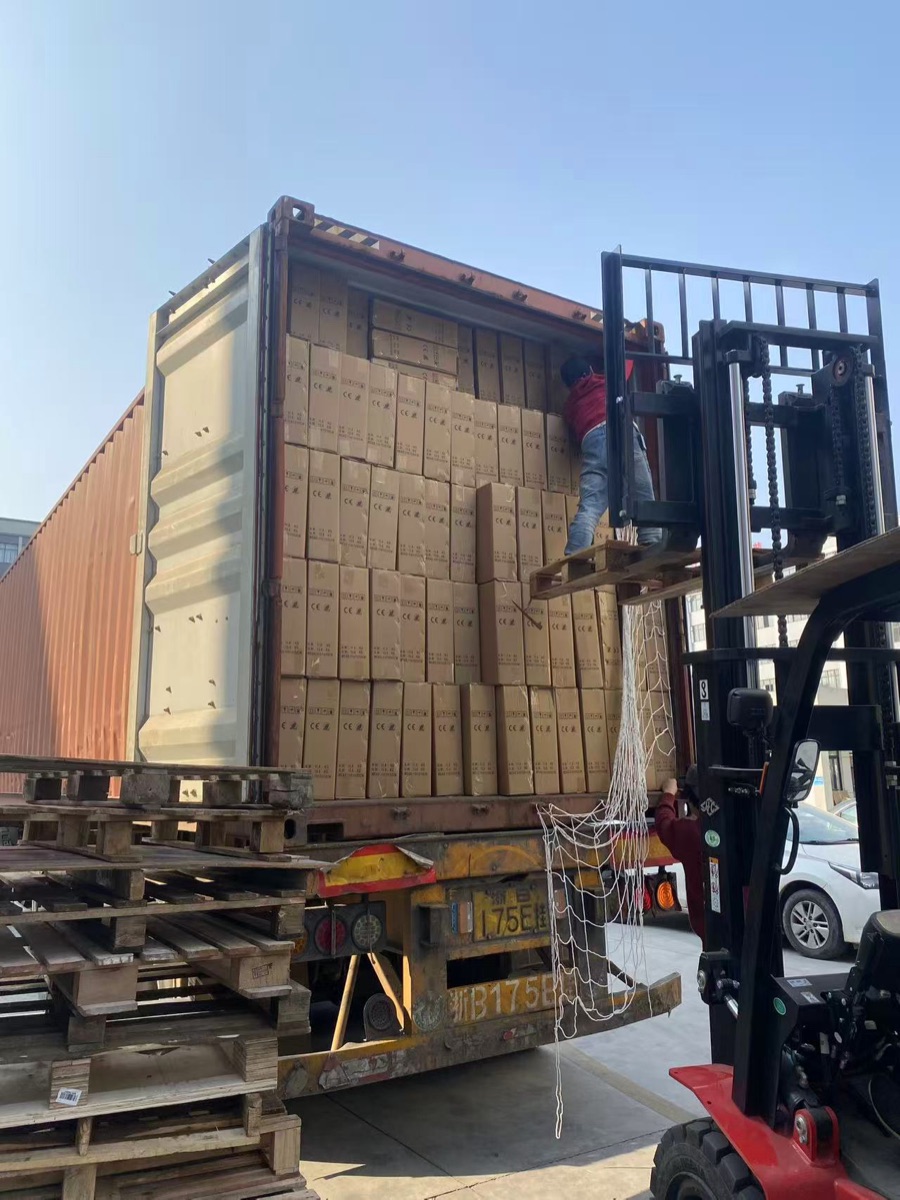 KAILEX fitness equipment cartons being loaded into a container